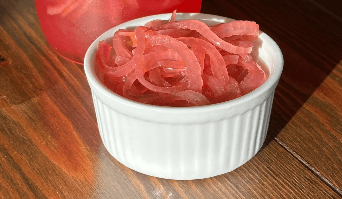 pickled red onions in a white ramekin