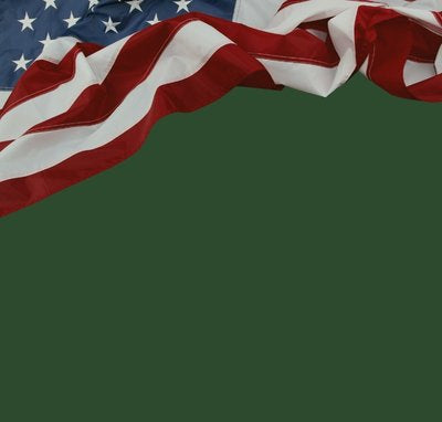 American flag waving on a green background
