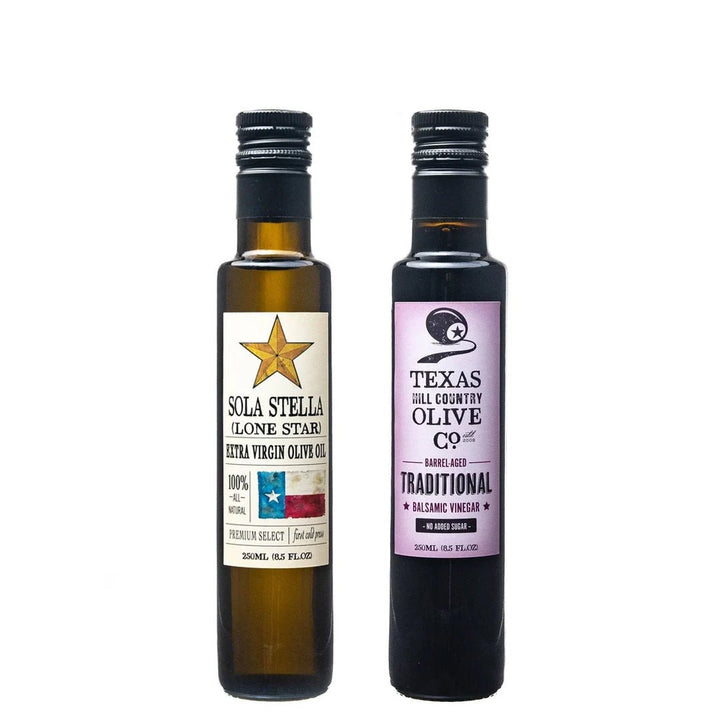 250 ml bottles of Sola Stella Extra Virgin Olive Oil and Traditional Aged Balsamic Vinegar on white.